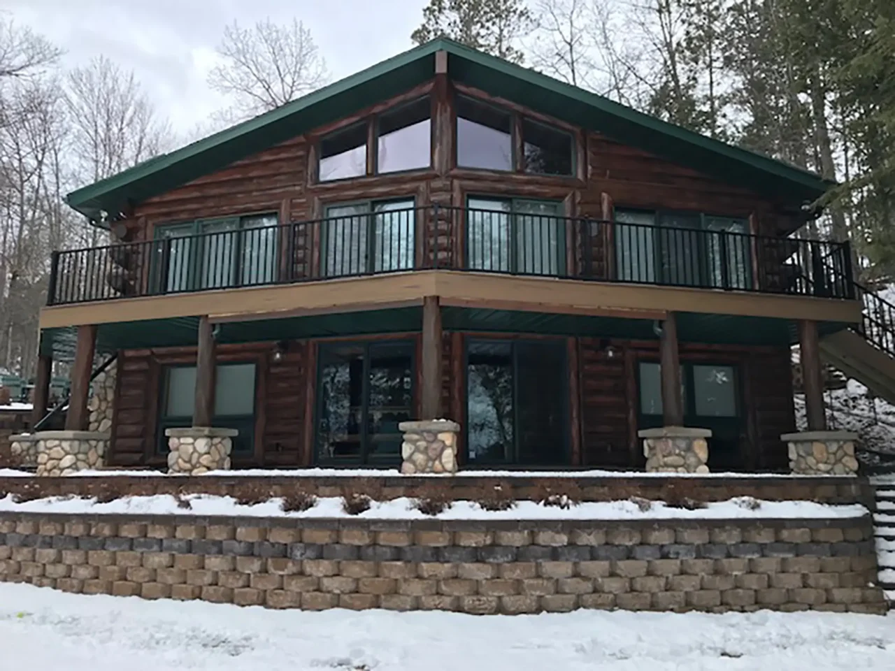 Rustic cabin upgrade with timbertech composite decking in remer mn